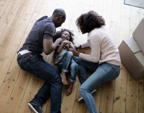 Testiimage | Wayne Maher Hardwood Flooring family on hardwood floor